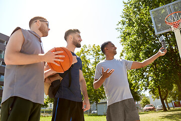 Image showing happy men taking selfie on basketball playground