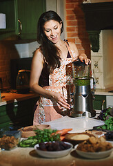 Image showing Staying at home woman using mixer for to prepare vegetarian food