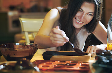 Image showing Staying at home woman preparing handmade vegetarian chocolate tr