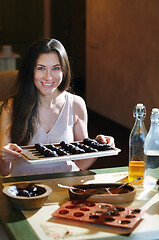 Image showing Staying at home woman preparing handmade vegetarian chocolate tr