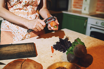 Image showing Staying at home woman preparing and cooking vegetarian food