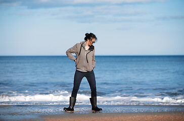 Image showing Happy woman having fun at the ocean