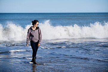 Image showing Happy woman having fun at the ocean