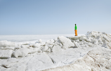 Image showing Young adult man outdoors exploring icy landscape