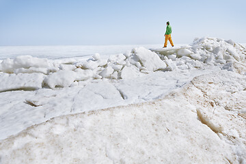 Image showing Young adult man outdoors exploring icy landscape