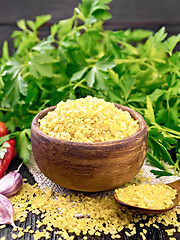 Image showing Bulgur in bowl with vegetables on dark board