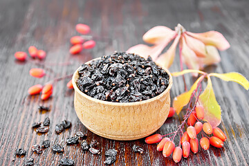 Image showing Barberry dried in bowl on dark wooden board