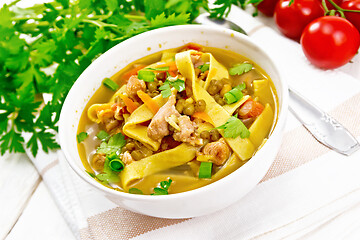 Image showing Soup with mung and noodles in bowl on light board