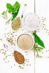 Image showing Flour buckwheat brown and green in bowls on light board top