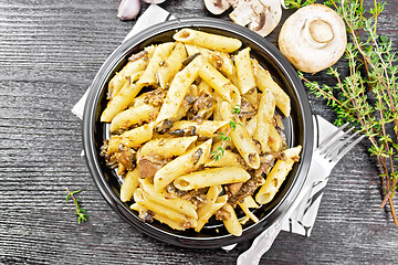 Image showing Pasta with mushrooms in plate on board top