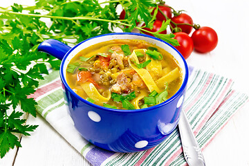 Image showing Soup with mung and noodles in blue bowl on napkin