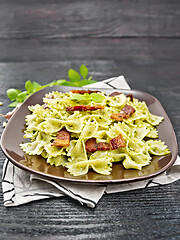 Image showing Farfalle with pesto and bacon on napkin