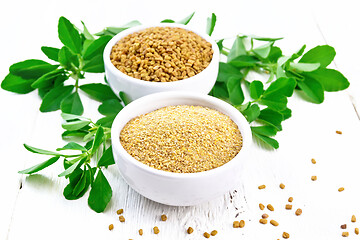 Image showing Fenugreek in two bowls with leaves on white board