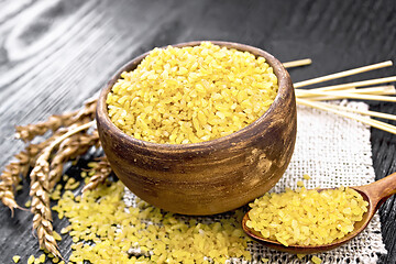 Image showing Bulgur in bowl on black board