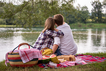 Image showing Couple taking a selfie by mobile phone while enjoying picnic tim