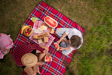 Image showing top view of couple enjoying picnic time