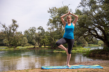 Image showing woman meditating and doing yoga exercise