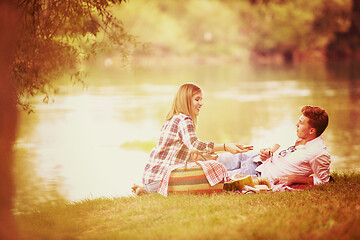 Image showing Couple in love enjoying picnic time