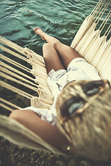 Image showing blonde woman resting on hammock