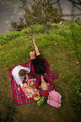 Image showing top view of couple enjoying picnic time