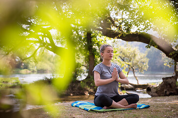 Image showing woman meditating and doing yoga exercise