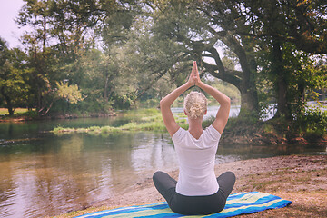 Image showing woman meditating and doing yoga exercise