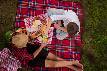 Image showing top view of couple enjoying picnic time