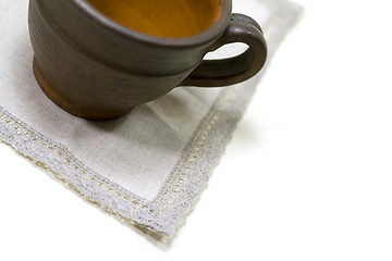 Image showing empty coffee cup and linen napkin