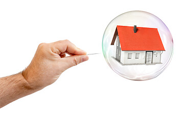 Image showing soap bubble with a house and a males hand with needle to let the