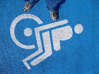 Image showing Logo for disabled  with valid person feet