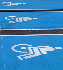 Image showing 3 Logos for disabled on supermarket parking