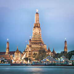 Image showing Wat Arun, The Temple of Dawn, at twilight, view across Chao Phraya river. Bangkok, Thailand