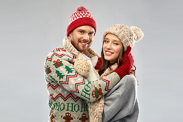 Image showing happy couple at christmas ugly sweater party