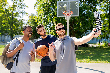 Image showing happy men taking selfie at basketball playground