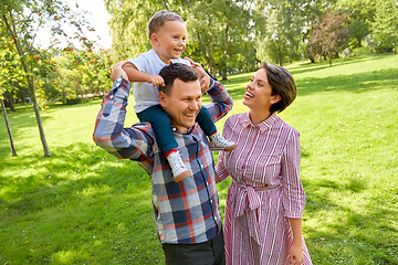 Image showing happy family having fun at summer park