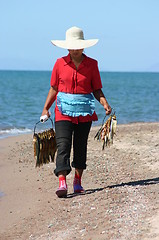 Image showing Girl with fish