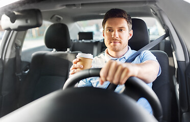 Image showing man or driver with takeaway coffee cup driving car