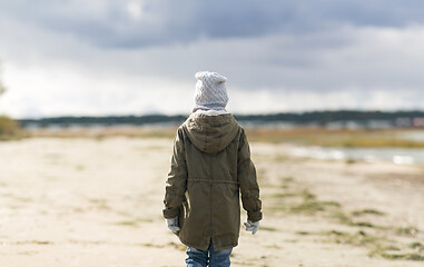 Image showing little girl on beach in autumn