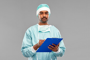 Image showing indian male doctor or surgeon with clipboard