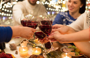 Image showing close up of friends with wine celebrate christmas