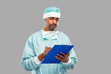 Image showing indian male doctor or surgeon with clipboard