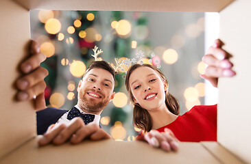 Image showing happy couple opening christmas gift box