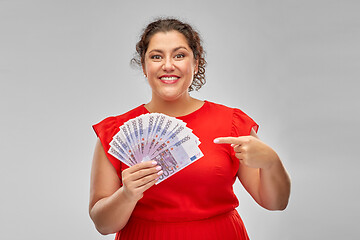 Image showing happy woman showing euro money banknotes