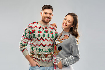 Image showing happy couple at christmas ugly sweater party