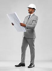 Image showing indian male architect in helmet with blueprint