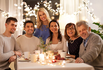 Image showing happy family having tea party at home