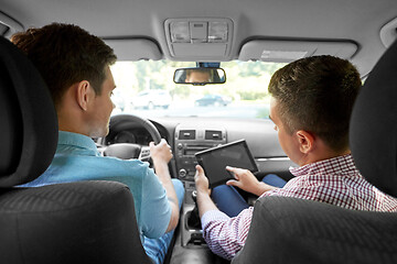 Image showing car driving school instructor and young driver