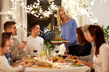 Image showing happy family having dinner party at home