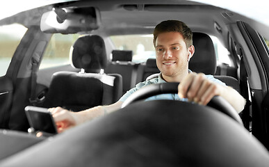 Image showing man or driver driving car and using gps navigator