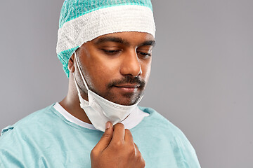 Image showing face of sad doctor or surgeon with protective mask
